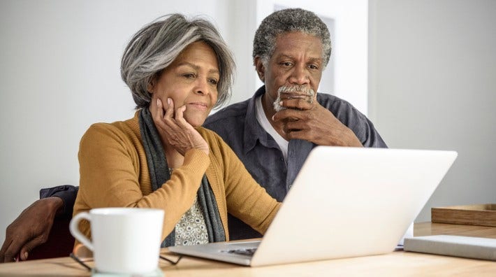 couple looking at laptop computer screen